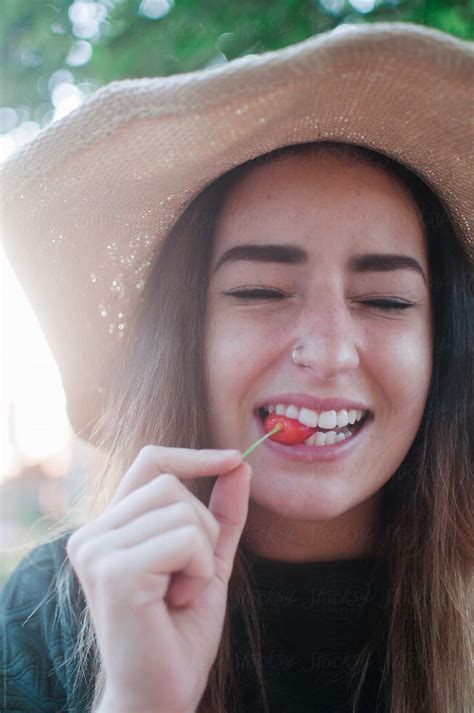 Young Woman Eating A Cherry By Stocksy Contributor Chelsea Victoria Stocksy