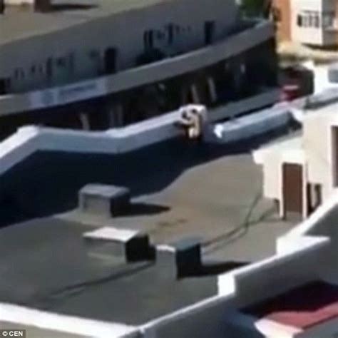 Video Of Kazakhstani Lovers Caught Having Sex On The Roof Of A Block Of Flats Daily Mail Online