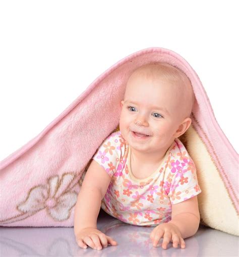 Baby Girl Hiding Under Blanket Over White Background Stock Photos