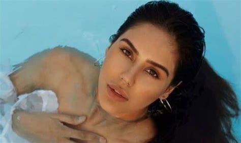 Punjabi Hotshot Sonam Bajwa Looks Scorching Hot In White Bikini As She Takes A Dip In The Pool