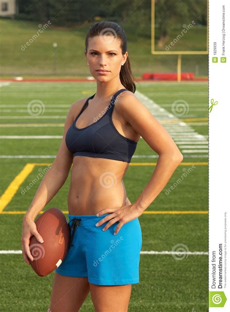 Young Woman In Sports Bra Holding Football With Hand On Hip Stock Image Image Of Leggins