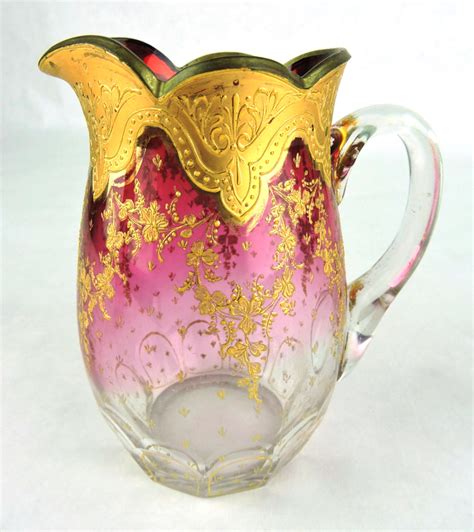 19th C Signed Moser Glass Small Cranberry Pitcher With Heavy Gold And Leaves Decoration