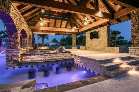 Luxury Living Fantastic Multi Use Pool Area With Swim Up Bar Built In