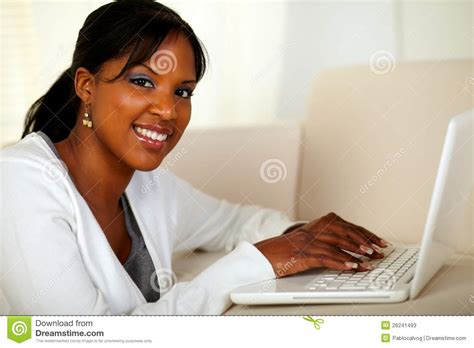 Young Woman Looking At You While Working On Laptop Stock Image Image