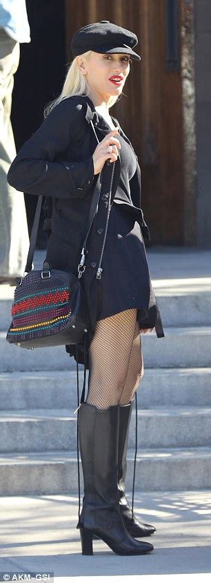 Gwen Stefani Stuns In Fishnet Tights With Knee High Leather Boots