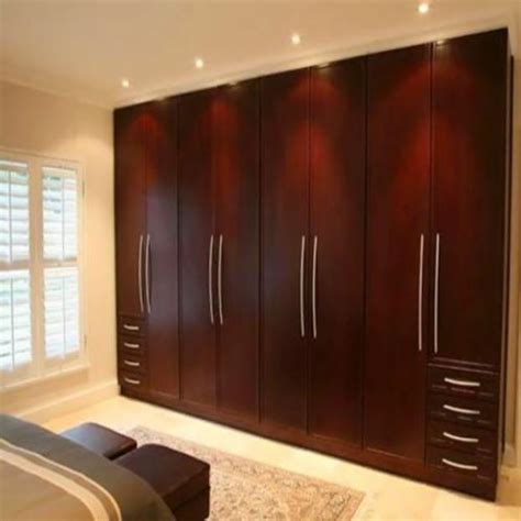 The lower cabinets are simple and have circular handles to open and close them. Bedroom Cupboard at Rs 1250/square feet(s) | Hadapsar ...