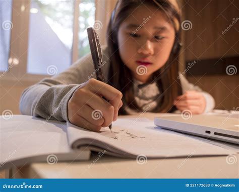 Close Up Hand Of Asian Girl In Headphones Sit At Desk Study Online On