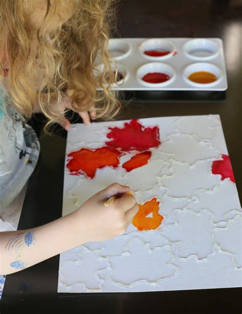 There are two fun ways to use plastic wrap in this easy art activity for kids. Fall Leaf Watercolor Resist Art