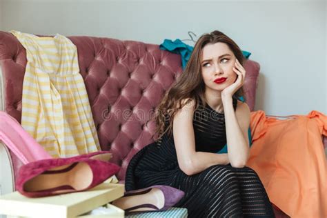 portrait of a tired exhausted girl in dress sitting on a sofa stock image image of choice