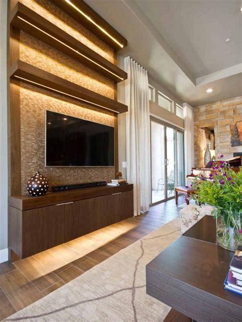 Hit the black box from all sides by hanging frames, flanking it with lamps, and adding bold touches below. 7 Entertainment Centers for Displaying More Than Just Your ...