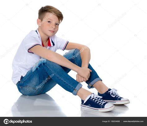 Fashionable Boy Teen Sitting On The Floor Stock Photo By ©lotosfoto1