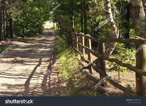 Old Wooden Fence In The Forest By The Path Stock Photo 148394720