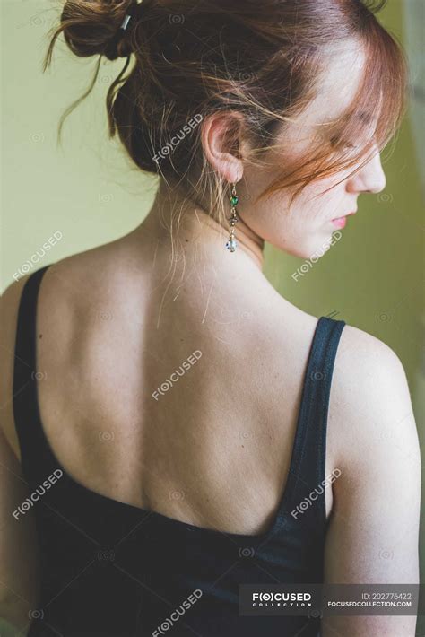 Rear View Portrait Of Young Woman Looking Over Shoulder — 20 To 24