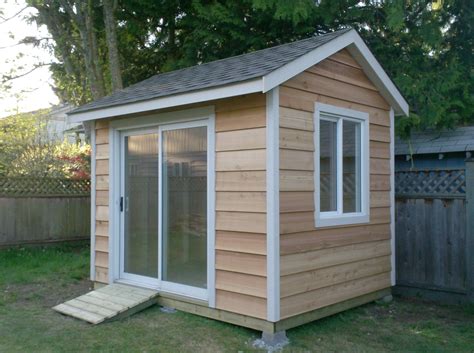 This is an 8x10 Shed with cedar siding with a sliding door | Backyard