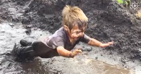 Boy Jumps Into Mud Puddle And This Footage Of Him Is Something You Don