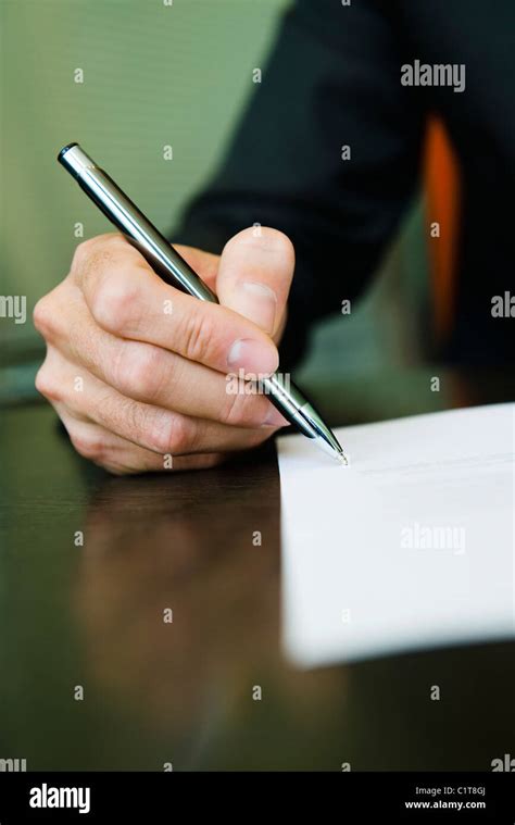 Person Signing Paperwork Cropped Stock Photo Alamy