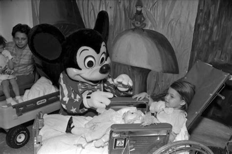 Florida Memory • Mickey Mouse Visits With Child At A Hospital