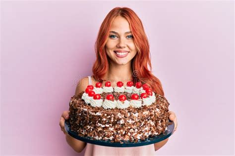 Young Redhead Woman Celebrating Birthday With Cake Smiling With A Happy And Cool Smile On Face