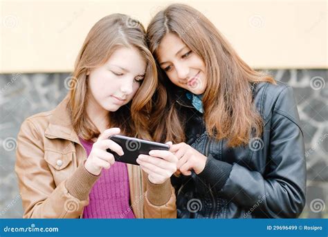 Two Girls Friends With Mobile Touch Phone Stock Image Image Of