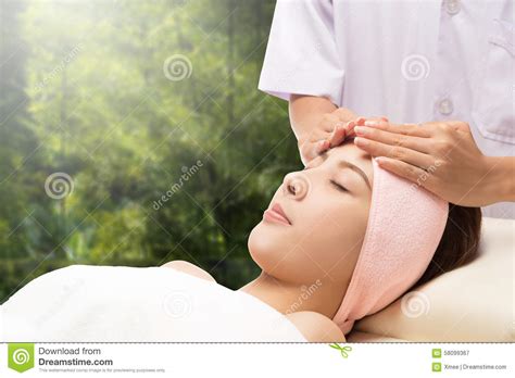 Relax Beautiful Asian Woman Facial Receiving Massage Stock Image