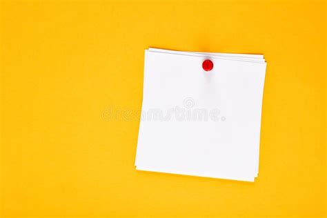 Blank White Note Paper Pinned With A Push Pin On A Yellow Board Stock