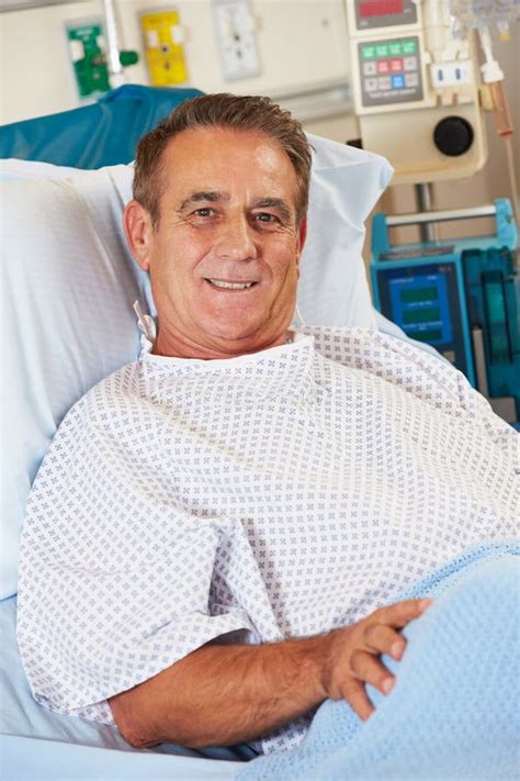 Portrait Of Male Patient Relaxing In Hospital Bed Stock Image Image