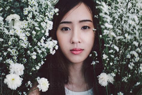 Beautiful Young East Asian Woman Portrait From The Flower Bush By Nabi Tang