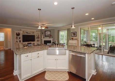 Angled kitchen features a pair of linen box pendant lights illuminating an an angled kitchen island topped with white marble counters fitted with. Pin by Barbara Vicare on Angled kitchen islands | Corner ...