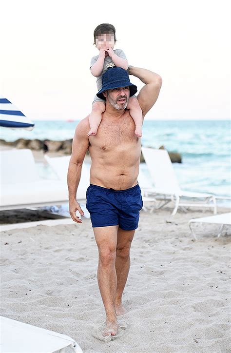 Andy Cohen Reveals Toned Abs While On Vacation With Son Benjamin