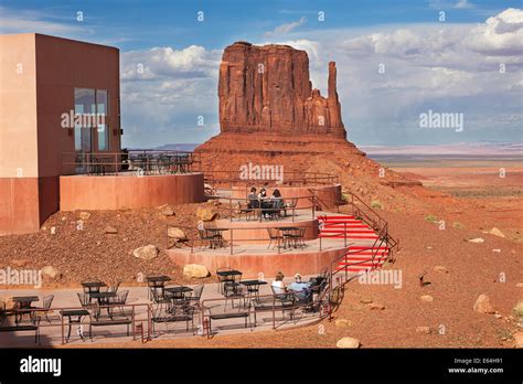 Tourists Sitting On The Terrace Of The View Hotel In Monument Valley
