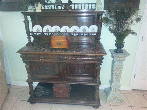 This walnut table has a white marble top with mild stains over an elaborately carved base. Victorian Era Belgian Walnut sideboard, Antique, marble top, beautiful carvings, working lock ...
