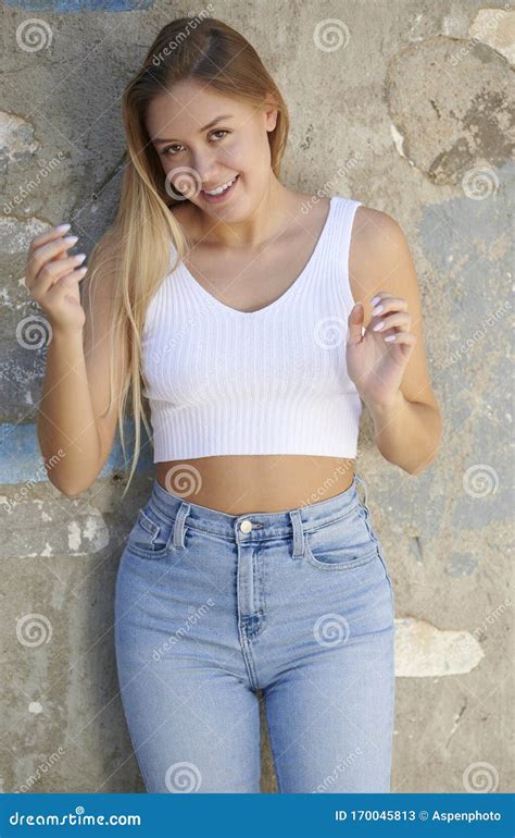 Stunning Young Latina Woman Poses In White Tank Top And Denim Desert Stock Image Image Of