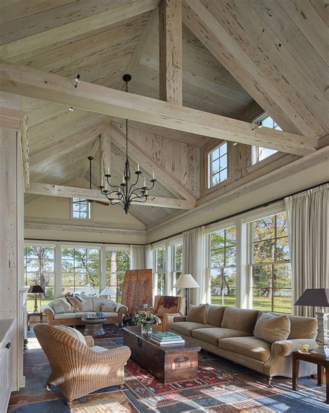 Great room at waterfront estate with beams and paneled cathedral