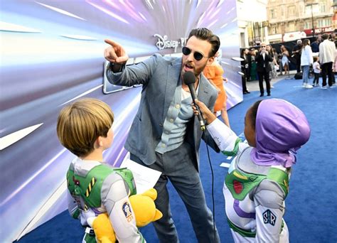 Chris Evans Poses Awkwardly With Mickey Mouse At Disneyland