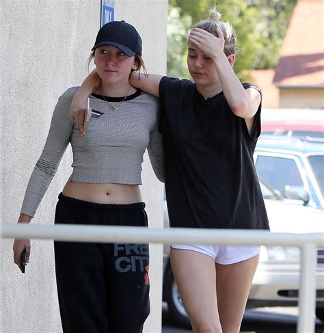 Miley cyrus couldn't control her excitement. MILEY and NOAH CYRUS Out and About in Los Angeles 07/29 ...