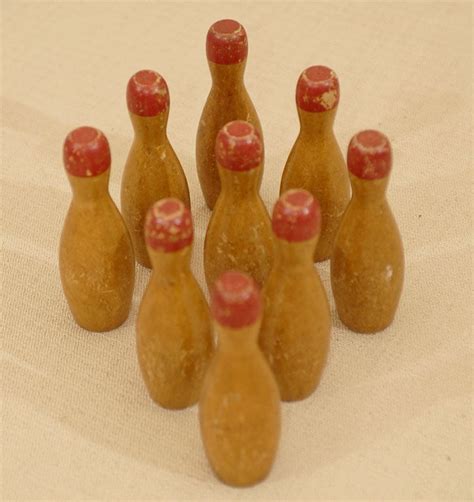 Set Of Nine Miniature Bowling Pins With Red Tops At 1stDibs