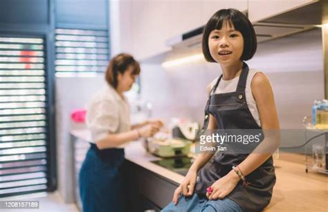 cute asian girl kitchen photos and premium high res pictures getty images