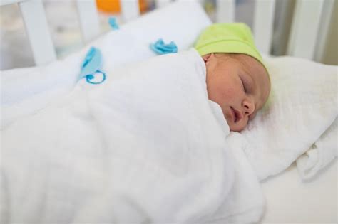 Premium Photo Newborn Baby Boy Sleeping In Bed