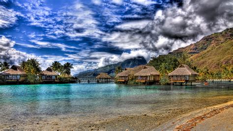 Tahiti Houses On Wooden Pillarssea Blue Sky And White Cloudsi Hd