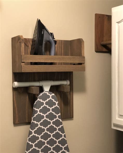 A practical, stable board that'll get the job done and so compact that you'll almost forget it exists!. Iron Board Holder | Ana White | Laundry room decor ...