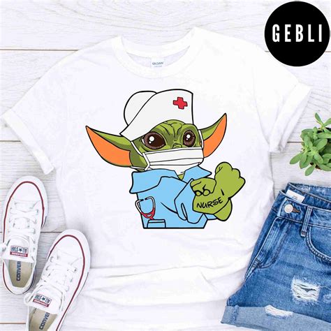Strong Baby Yoda Wearing Scrub Nurse Shirt Gebli