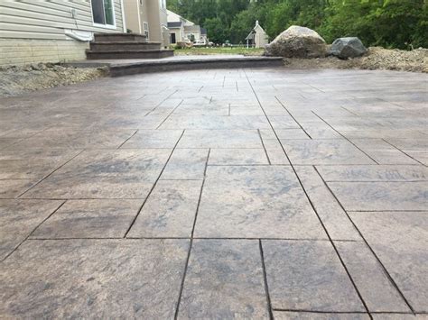 Stamped concrete costs depend on materials and labor, the complexity and number of different stamped concrete patterns used, and stains and coloring affects. Stamped concrete patio - ashlar pattern, integral color ...