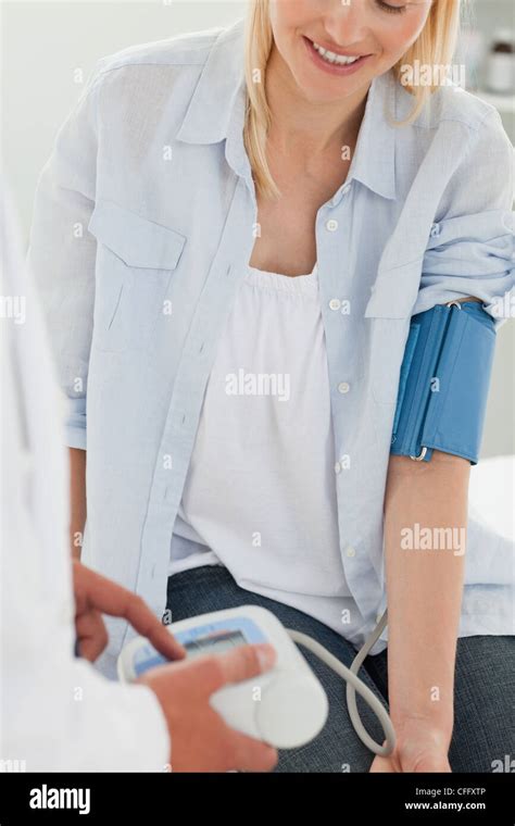Smiling Woman Getting Blood Pressure Measured Stock Photo Alamy