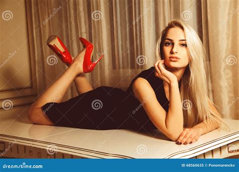 Young Beautiful Blonde Woman Lying On Table With Seduction Look Stock Image Image Of High