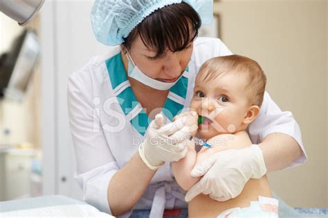 Baby Healthcare And Treatment Medical Help Injection Stock Photo
