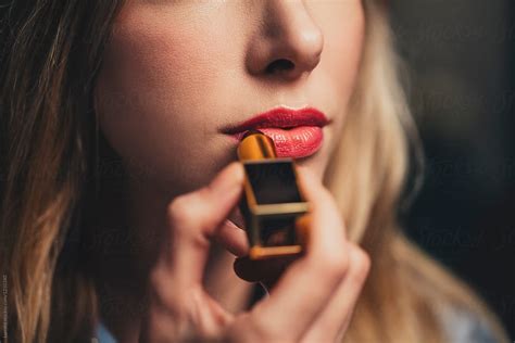 Woman Putting Lipstick On By Stocksy Contributor Lumina Stocksy