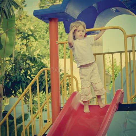 Boy On Playground Slide Stock Photo Image Of Child 113588030