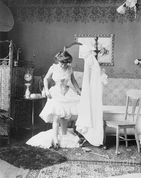 Victorian Woman Undressing In The Bath Photograph By Bettmann