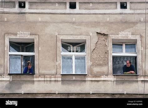 People Looking Out Of Windows Poznan Poland Stock Photo Alamy