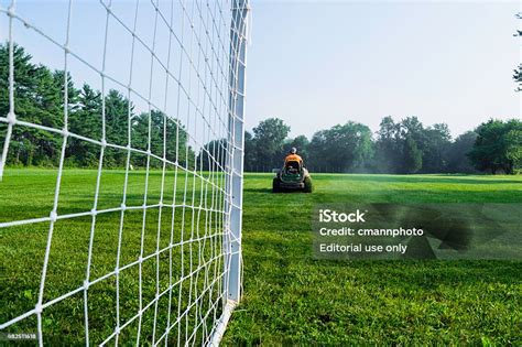 County Worker Mowing Soccer Field Grass Stock Photo Download Image
